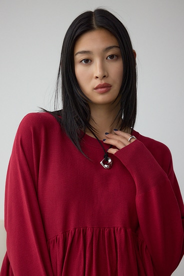 ペプラムデザインニットトップス